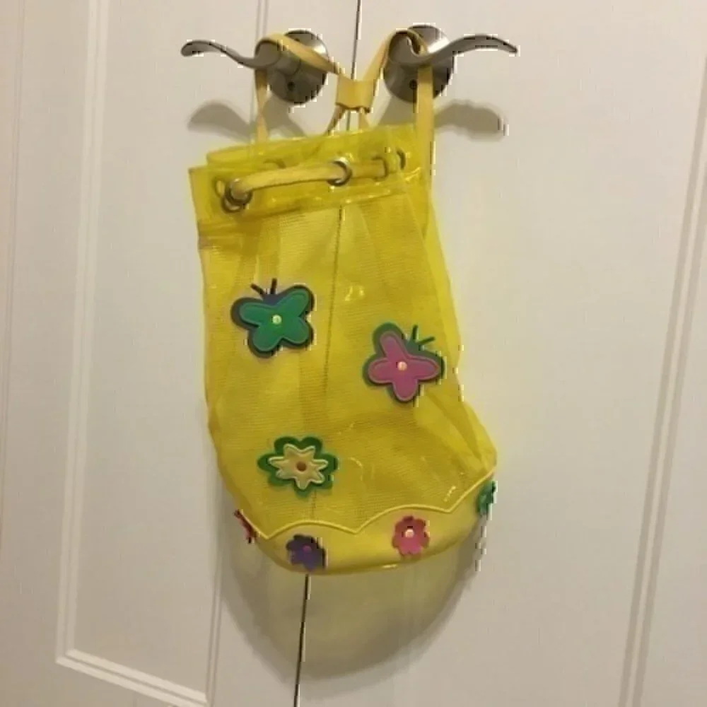 Girl’s yellow beach bag